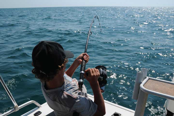 Casting a fishing pole.